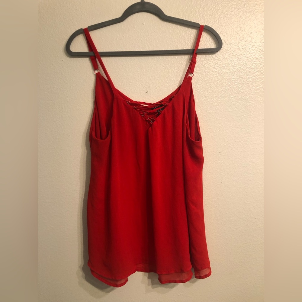 Torrid red blouse with cris cross detail in the front 0X